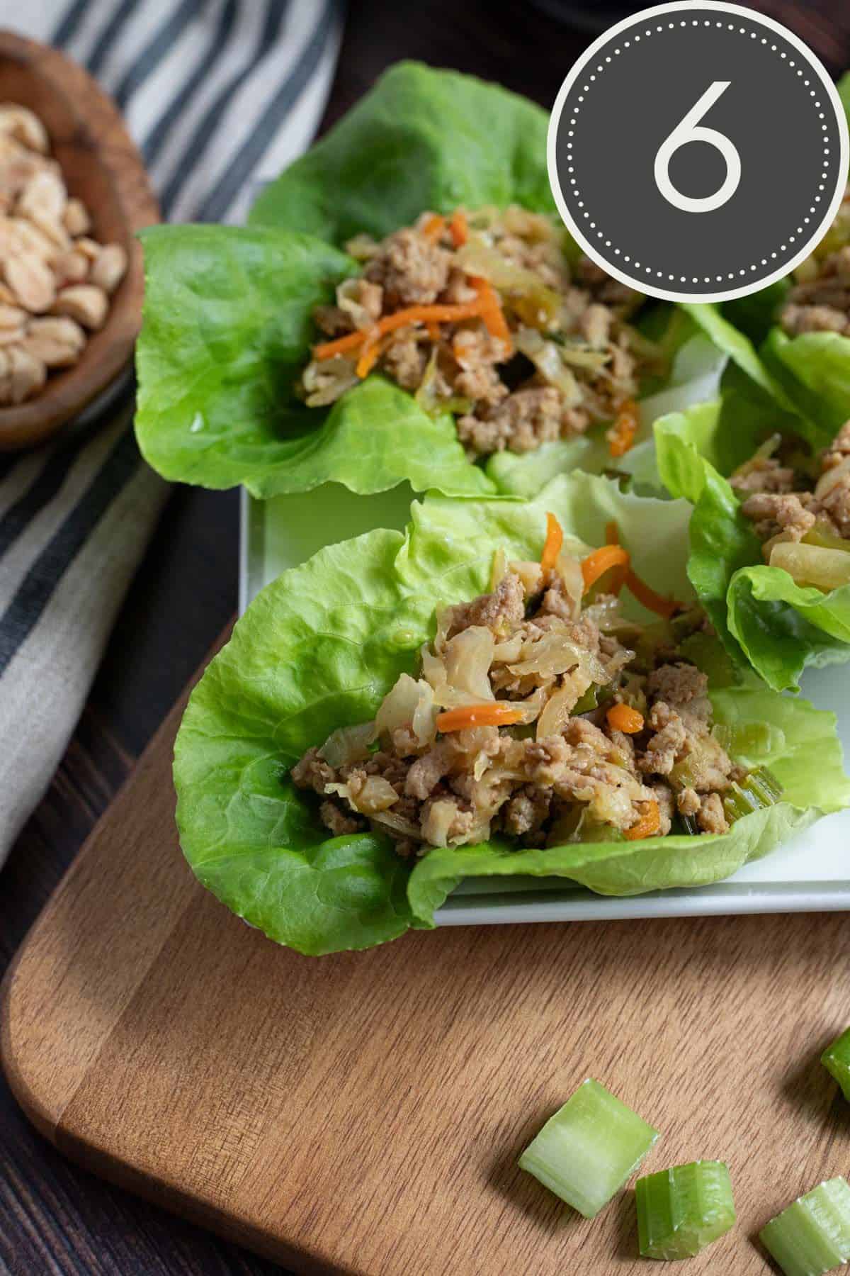 close up image of lettuce cups filled with the completed ground turkey mixture.